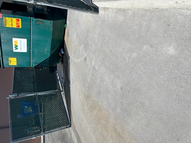 Dumpster pad cleaning after